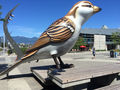 One of the big bird statues in the Olympic Village Square