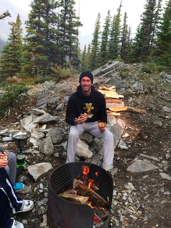 Enjoying breakfast by the campfire