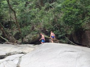 Negotiating slippery rocks Josephine Falls