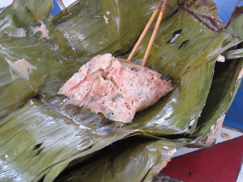 Pork and spices cooked in banana leaf. 