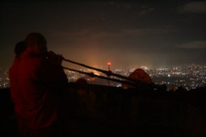 Horns On The Roof With Kathmandu Lights Behind