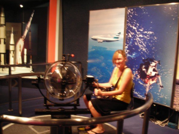 Melissa enjoying a 7 year olds ride in the space museum