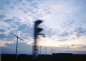 windmills swooshing, sunset, south of Rotterdam