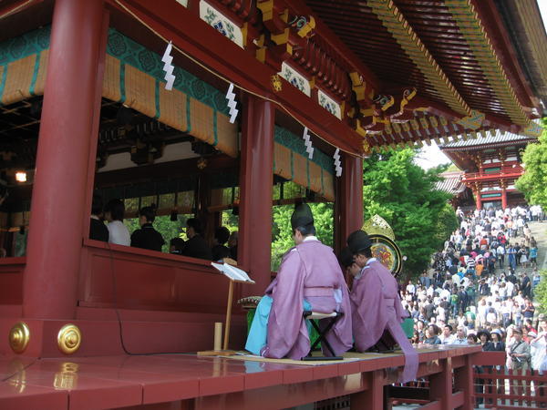 high class wedding shinto priests play the shakuhachi