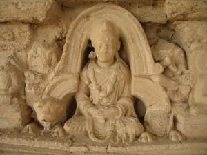 Budha Sakyamuni lotus position under an Indian arch
