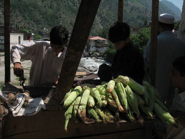 boys selling corn on the bridge, Behrein