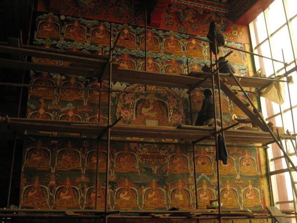 painting a mural of lamas, Chode Gompa