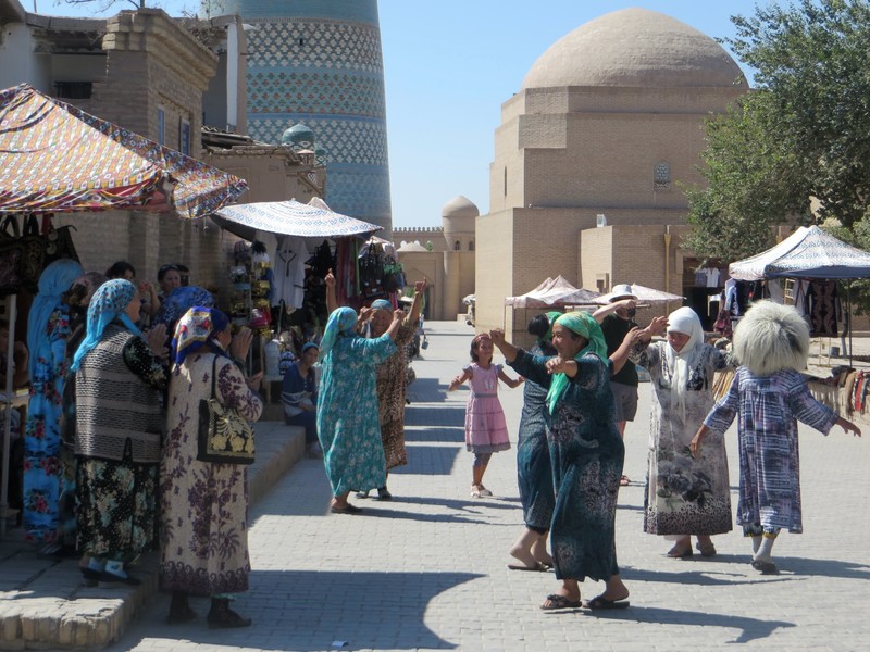 wedding guests dancing in the street, Khiva