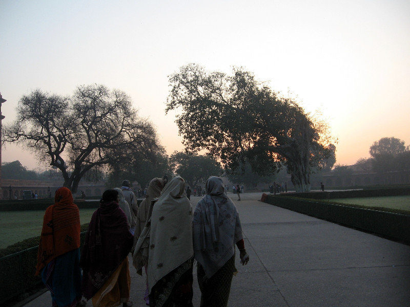 Indian Women Entering Taj Mahal Complex at Dawn