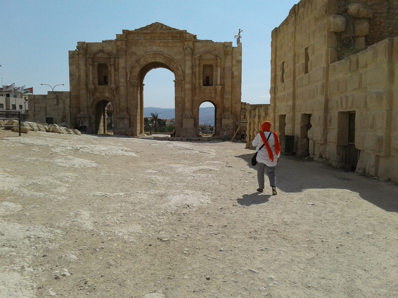 visitor at Hadrians arch in Jerash