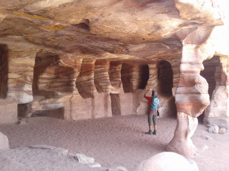 Inside a cave the beautiful layered natural colors of sandstone 