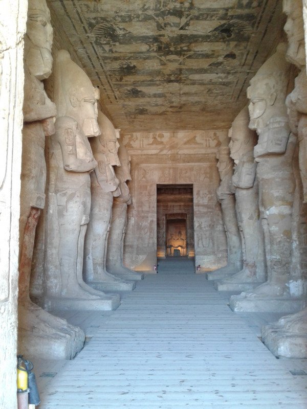 Inside the Temple entrance hall with 8 Ramsis Osirid statues.