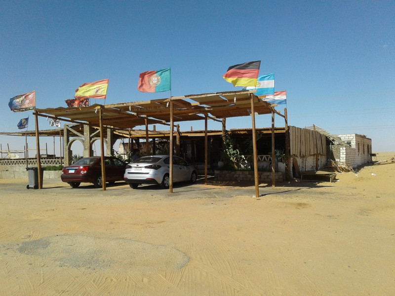 Our Rest stop in mid Sahara, flying international flags. It was a welcome break for my driver.