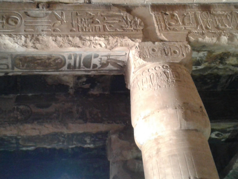 High overhead carved in stone among the unreachable hieroglyphs