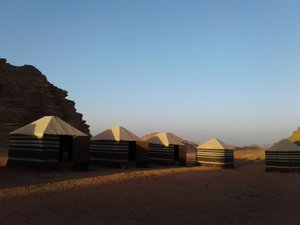 our tents at sun rise after a night with the Bedouin in the Jordanian desert 