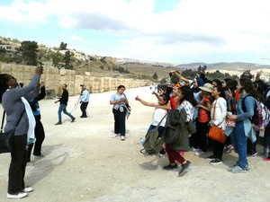MaBish takes a pic of the schoolgirl mob at Jerash, Jordan. Ally is lost in the middle. 