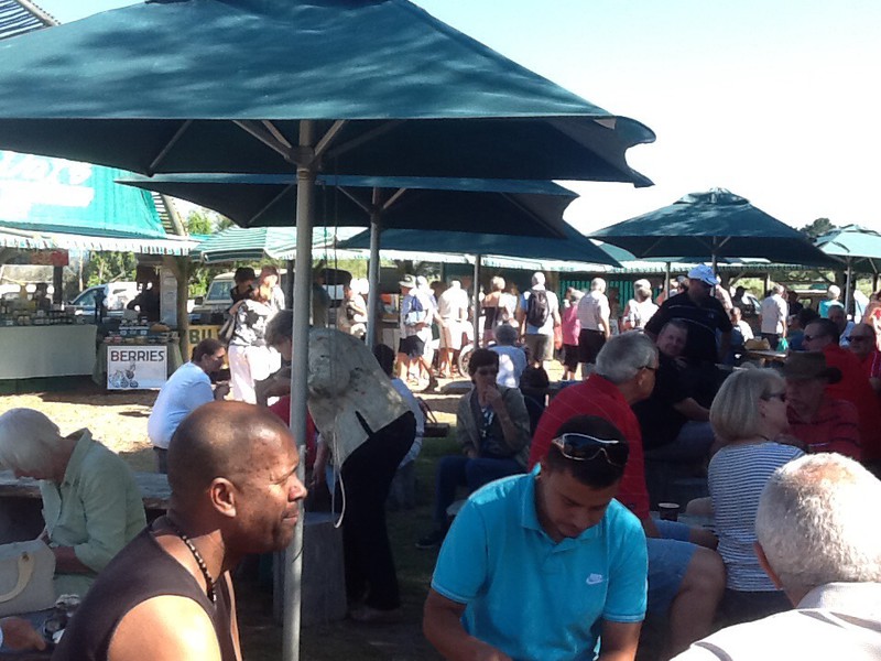 multi racial table at the Sedgefield farmers market