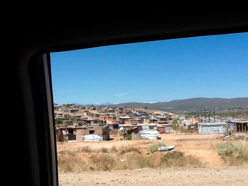 Long stretches of poor and ramshackle housing = a township 