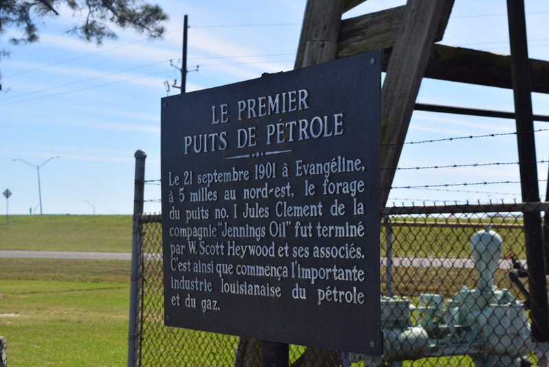 Sign in Front of Oil Rig 