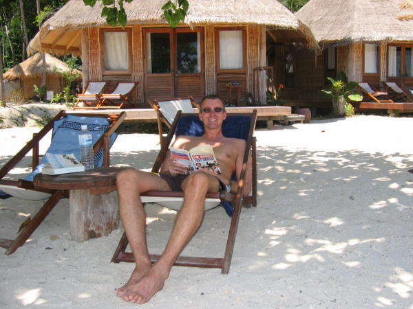 Nigel relaxing outside our bungalow.