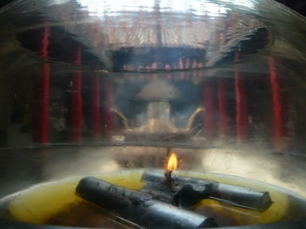 Burning oil in pagoda