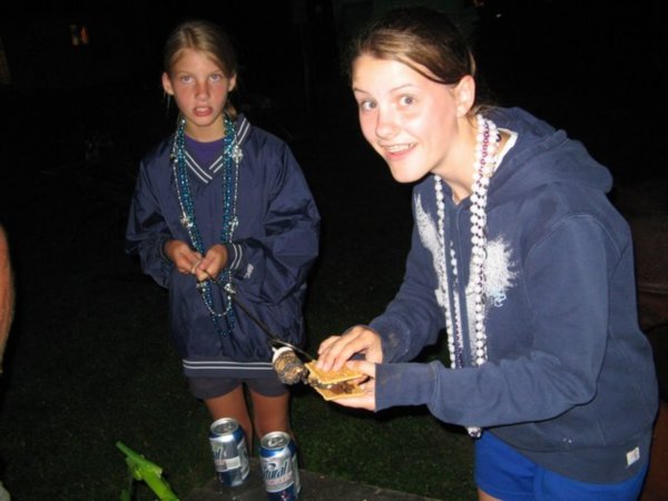 Beth and Gracie (with Beer Can knee pads) making smores.