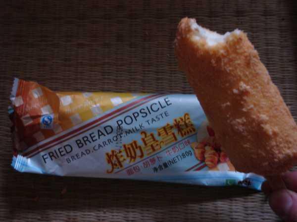 A carrot and fried bread popsicle