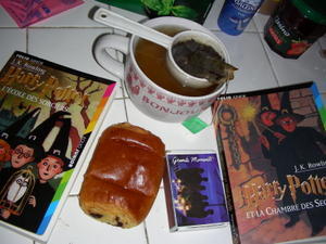 all that i need for a nice day inside: tea in my bonjour mug, a pain au chocolat, my harry potter books, and some cutesie matches, which found their way into the picture somehow