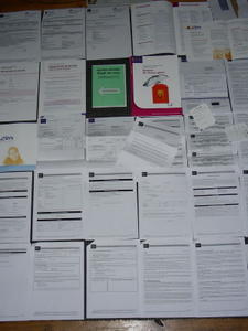 this is easily MY favorite photo. here are all of the papers i have gotten from the bank thus far in regards to the two possible accounts that i have opened. nothing's certain, though