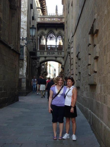 Mom and I outside the Bridge of Sighs in the Barri Gothic