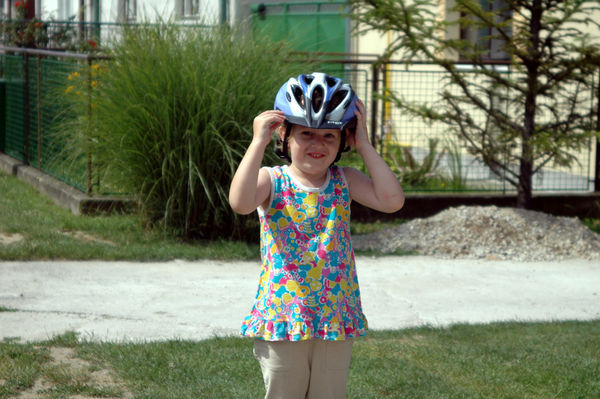 little Sara can't understand why anyone would want a helmet...but she tries it on for size anyway!