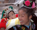 Miao woman with traditional baby carrier