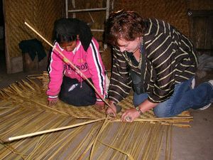 Christa making reed mats