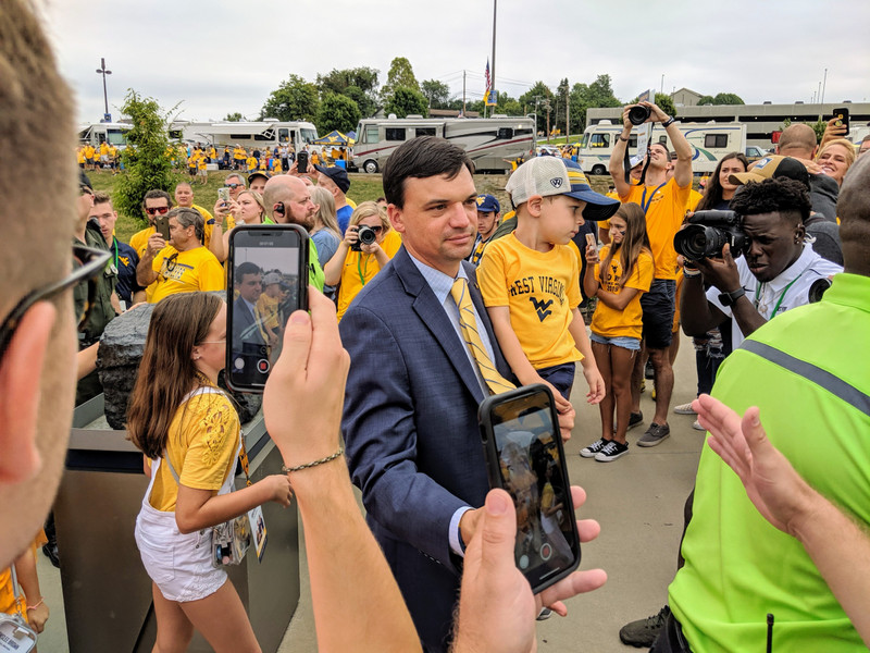 Coach Neal Brown greets fans during the Man Trip