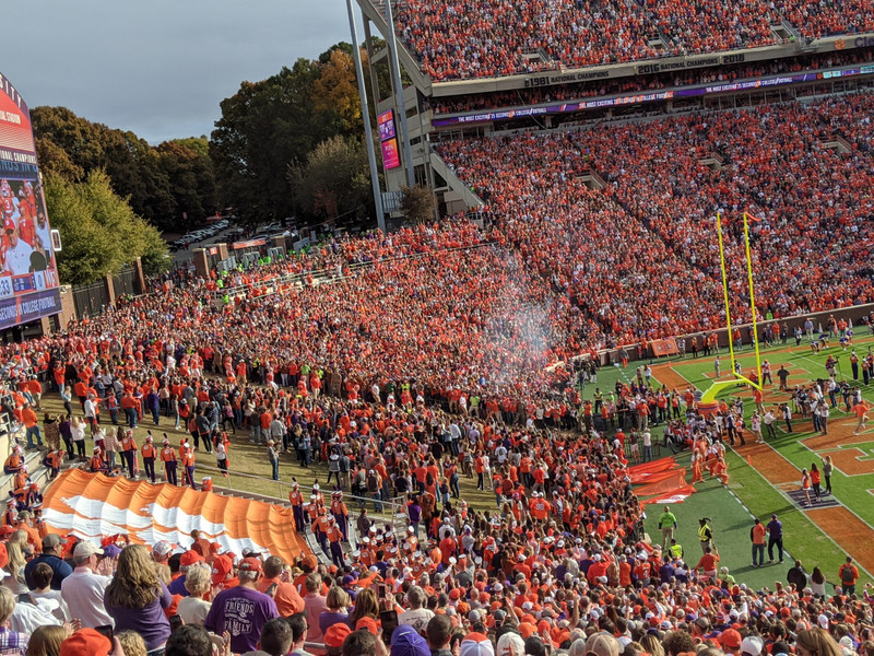 Clemson team about to run down the hill onto the field