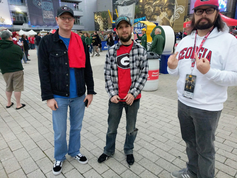 Dad insisted on taking a picture of us at the Fan Fest