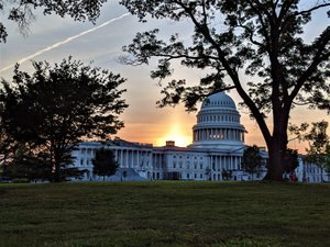 The sun sets on the US Capitol