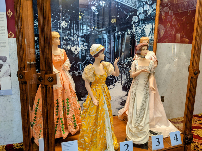 Display of miniature replica dresses in the main room