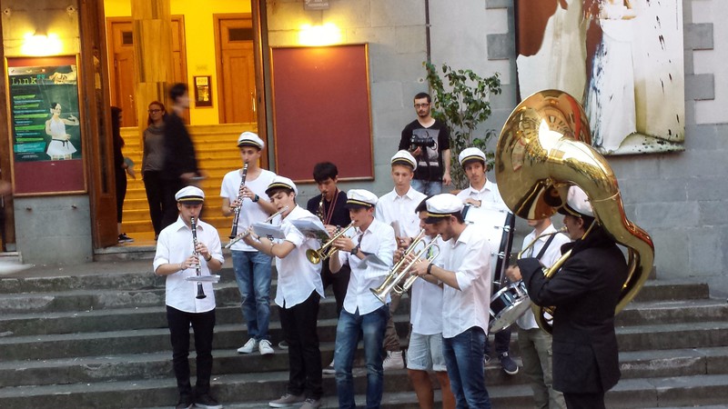 Some marching band-type group in front of the theatre