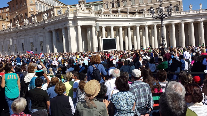 Can you see the Pope? He's in the white hat just underneath the screen