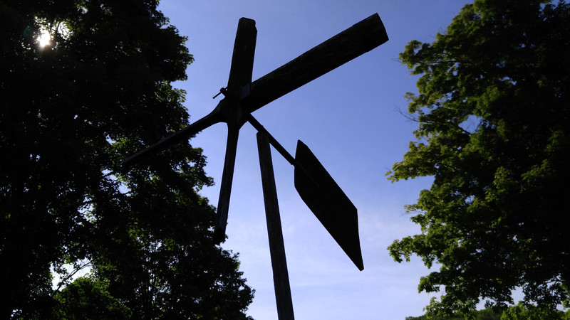 A whirligig made by Calvin Coolidge, Jr, still spin above the garden