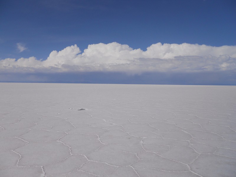 Unending vastness as far as the eye can see in the middle of the salt flat.