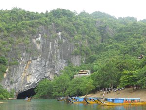 Dragon boats parked up outside Phong Nha Cave