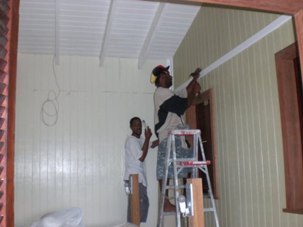 Kurt and Casso putting up picture rail
