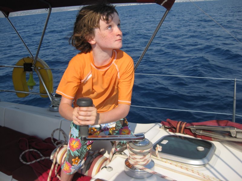 tom hoists the mainsail