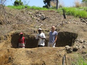 construction project - three men in a hole. this is for the septic tank