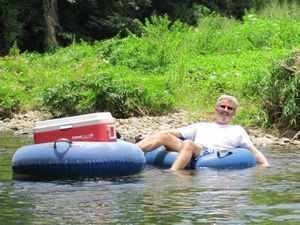 Sue and Patricia come to stay - river tubing on the Pagua river - Alan guards the beer