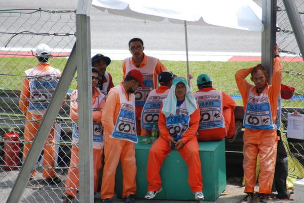 Race marshals taking cover from the heat