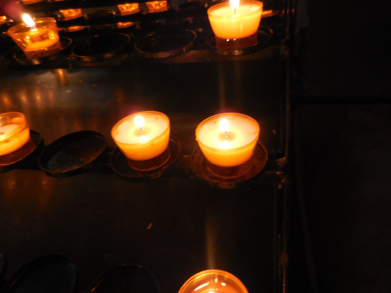 Candles lit for loved ones and peace