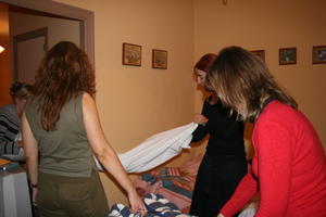 How many people does it take to make a bed?